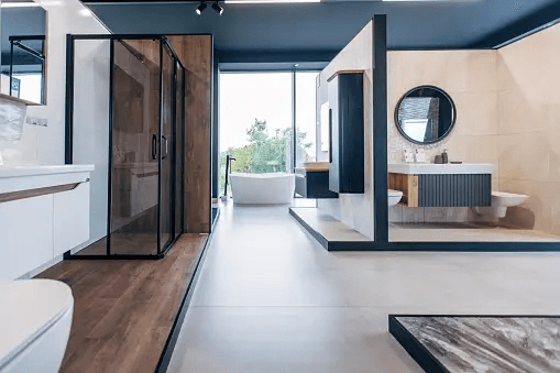 Modern bathroom with glass shower and outdoor bathtub area.
