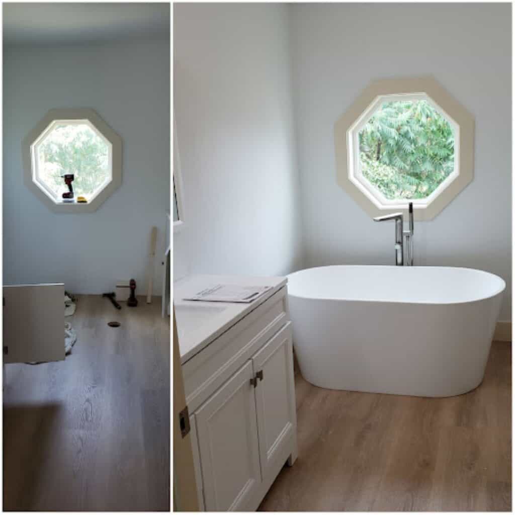Bright bathroom with a freestanding tub and octagonal window.
