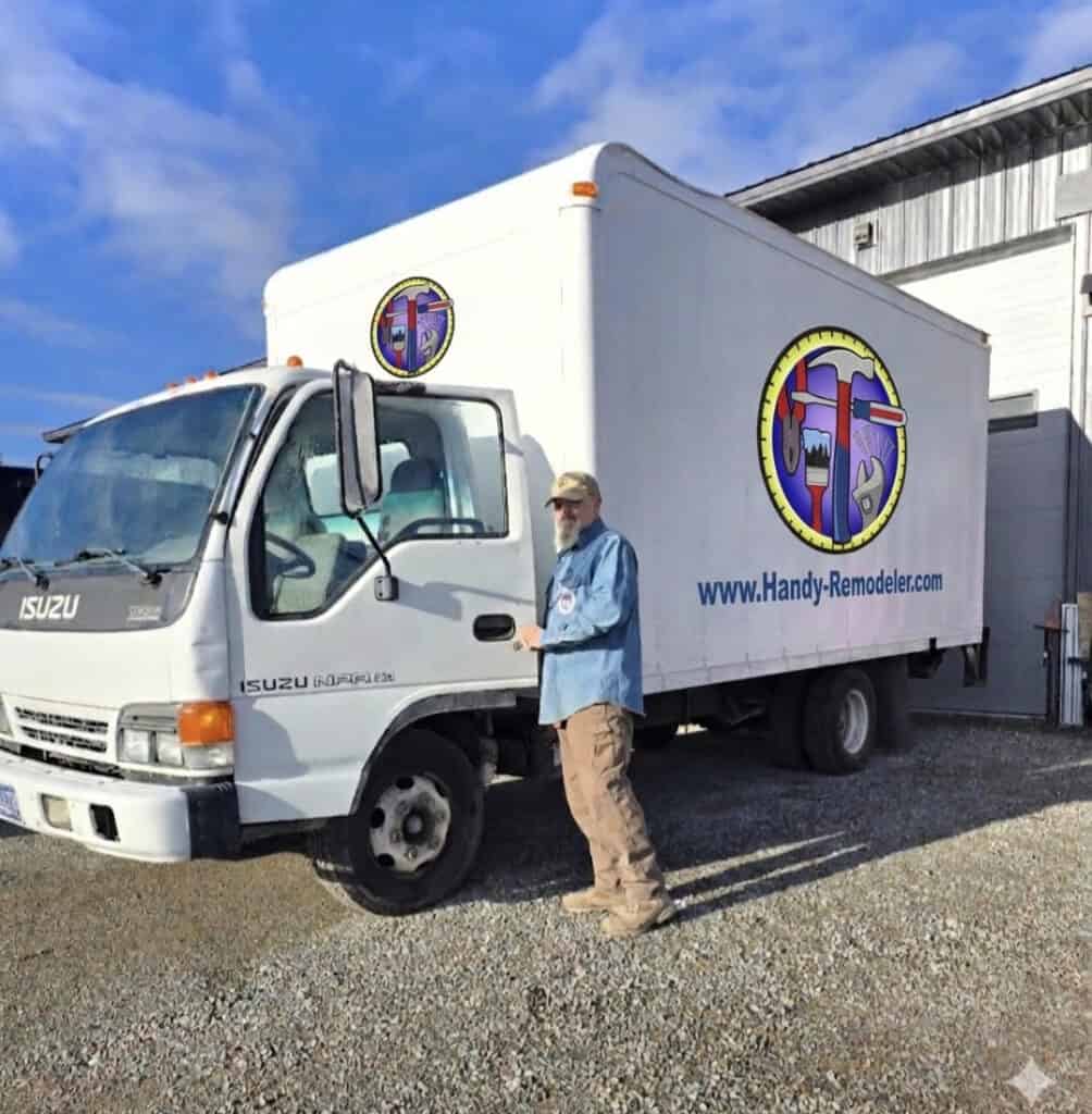 Handy-Remodeler service truck parked outside shop